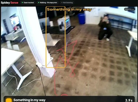 The glasses' view while walking: a box drawn around a power cord on the floor